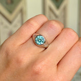 Vintage rub-over zircon & diamond ring on hand.