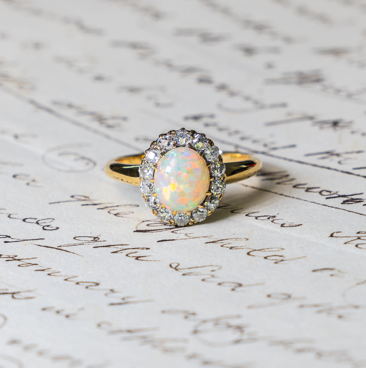 Antique, Edwardian white opal and diamond cluster ring front