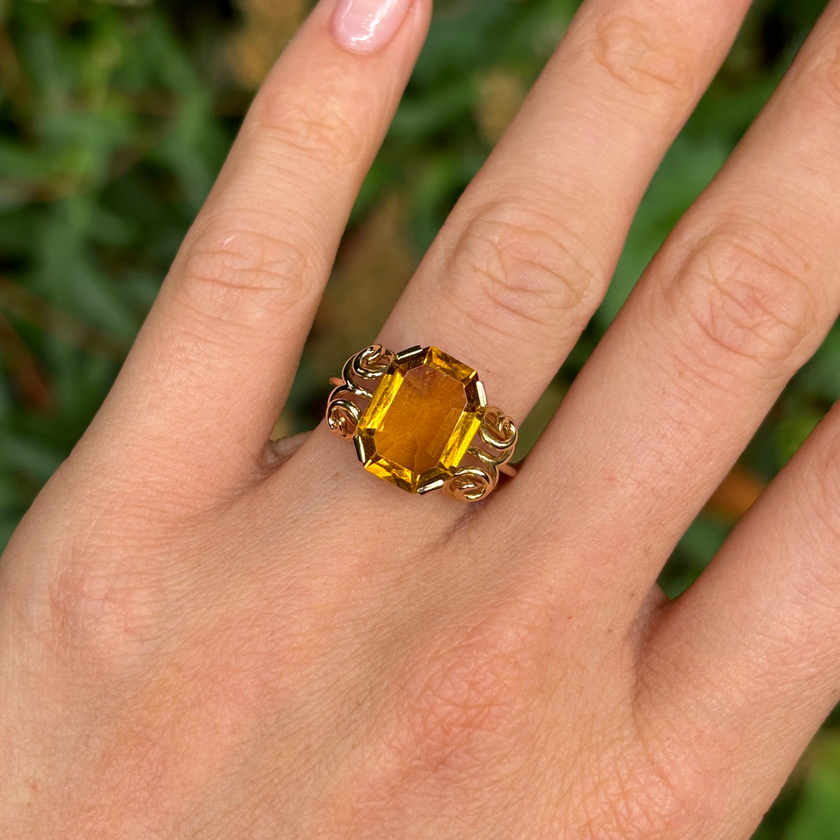 Vintage, 1940s citrine cocktail ring worn on hand.