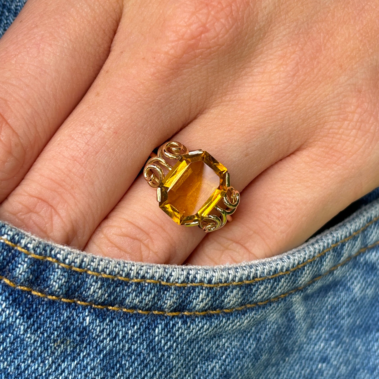 Vintage, 1940s citrine cocktail ring worn on hand.