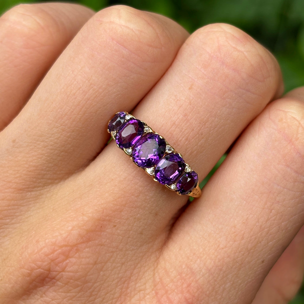 Antique, Victorian five-stone amethyst ring worn on hand