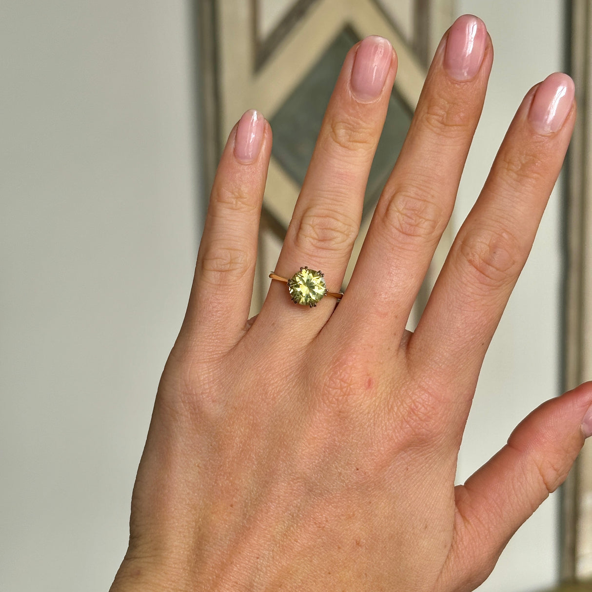 Vintage, 1980s single-stone chrysoberyl ring worn on hand.