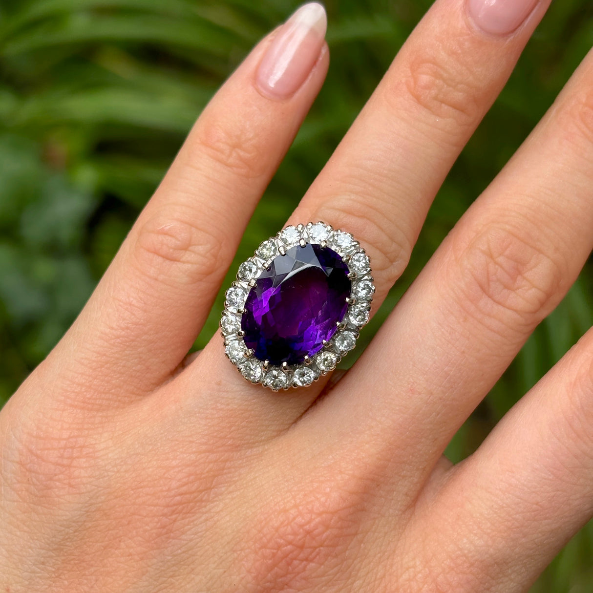 Antique, vintage amethyst & diamond cluster ring on hand