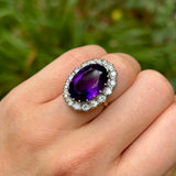 Antique, vintage amethyst & diamond cluster ring on hand.