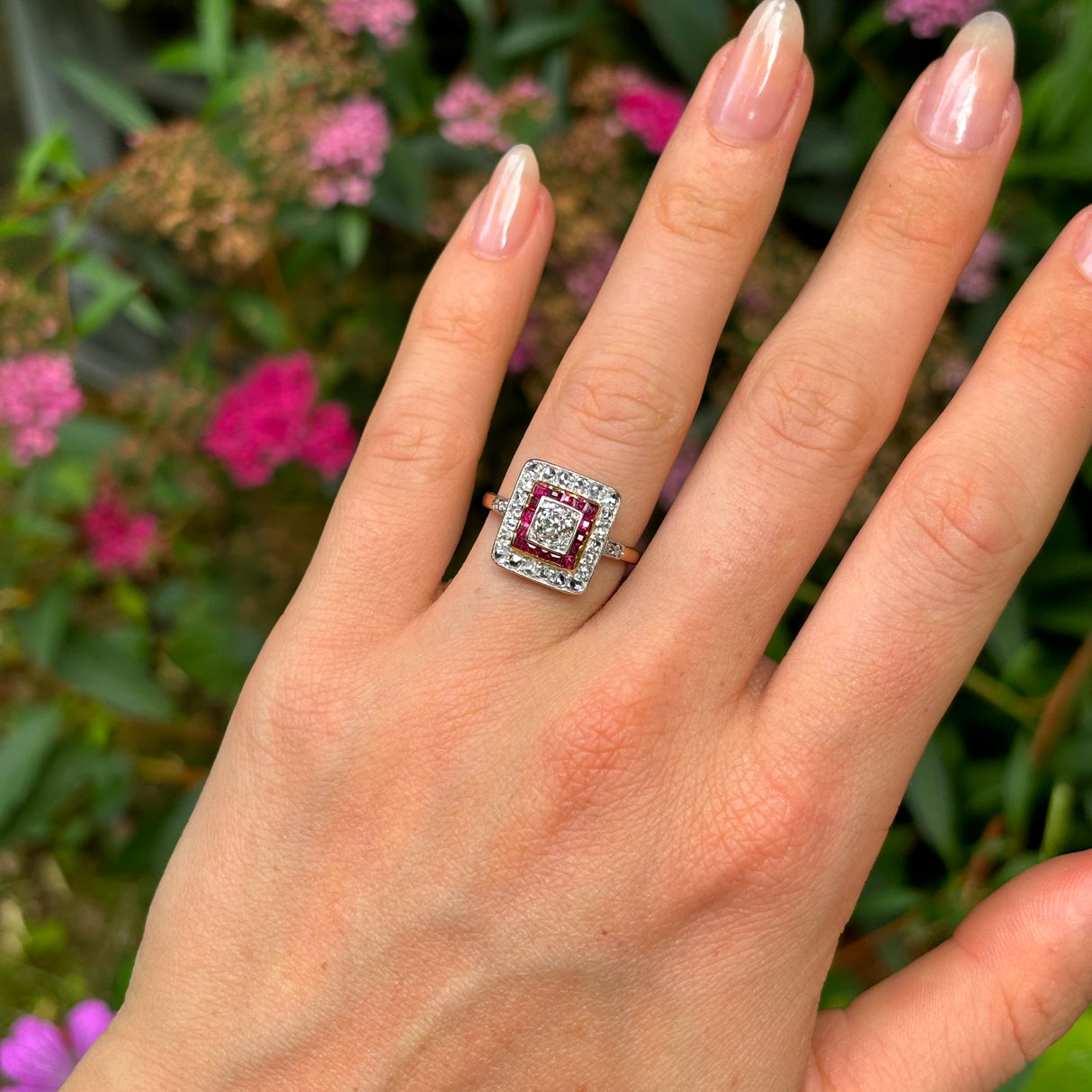 Vintage, diamond and ruby cluster ring, 18ct yellow gold and platinum worn on hand.