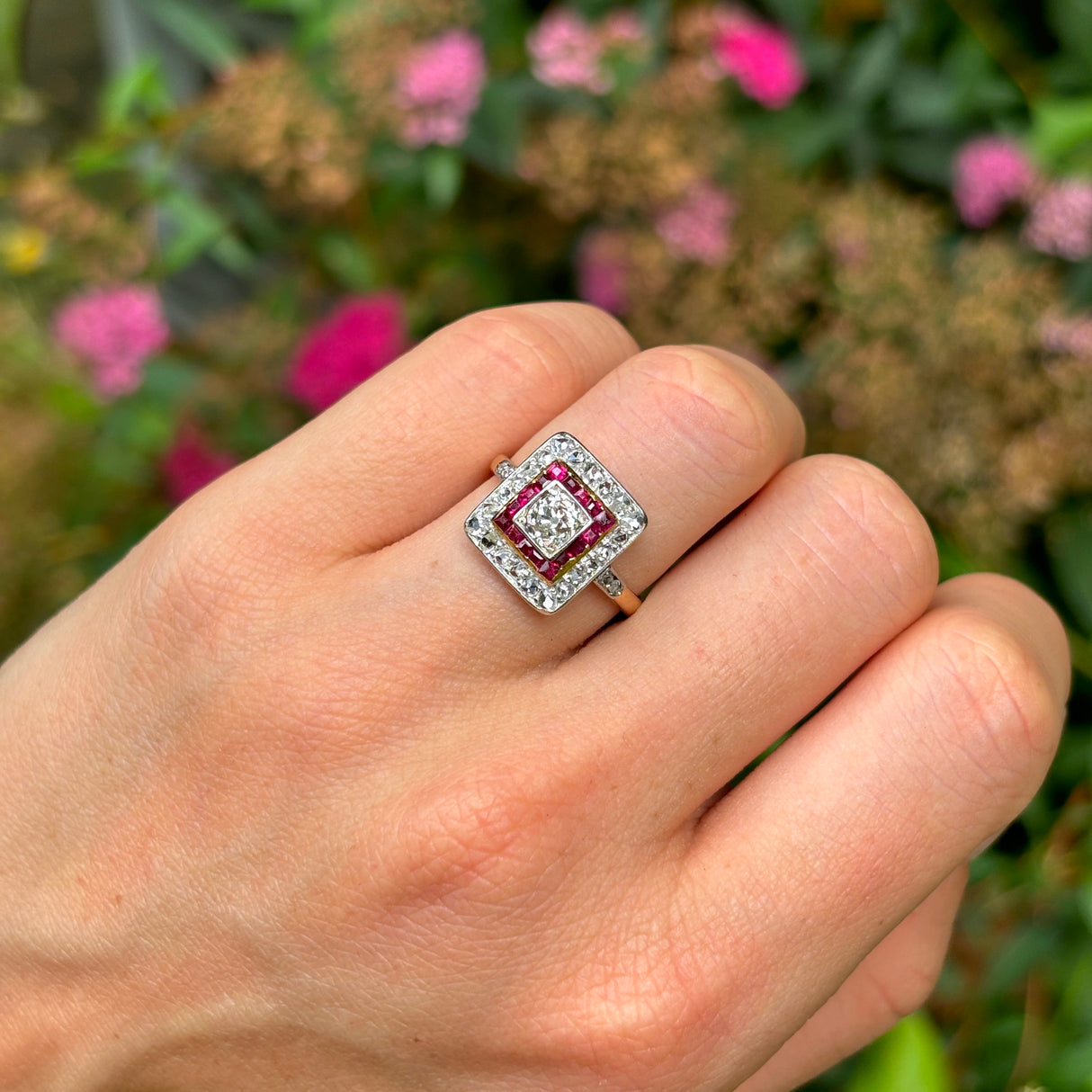 Vintage, diamond and ruby cluster ring, 18ct yellow gold and platinum worn on hand.