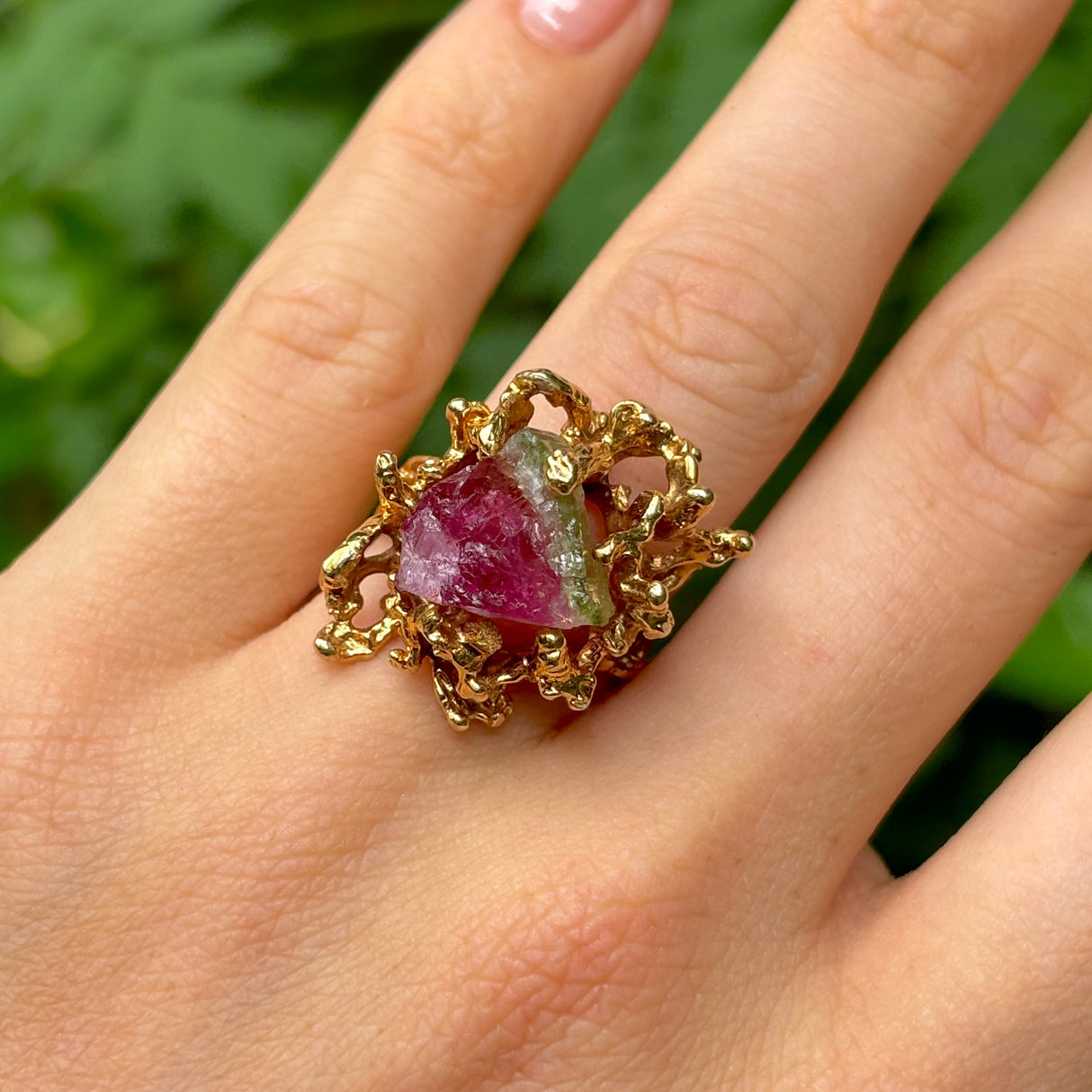 Vintage, 1970s watermelon tourmaline cocktail ring on hand.