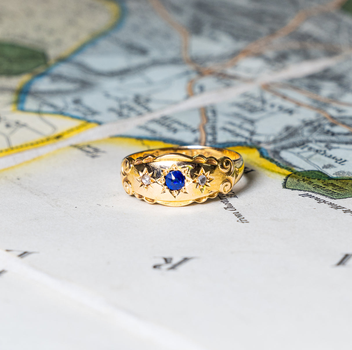 Antique, Edwardian sapphire and diamond three-stone gypsy ring front