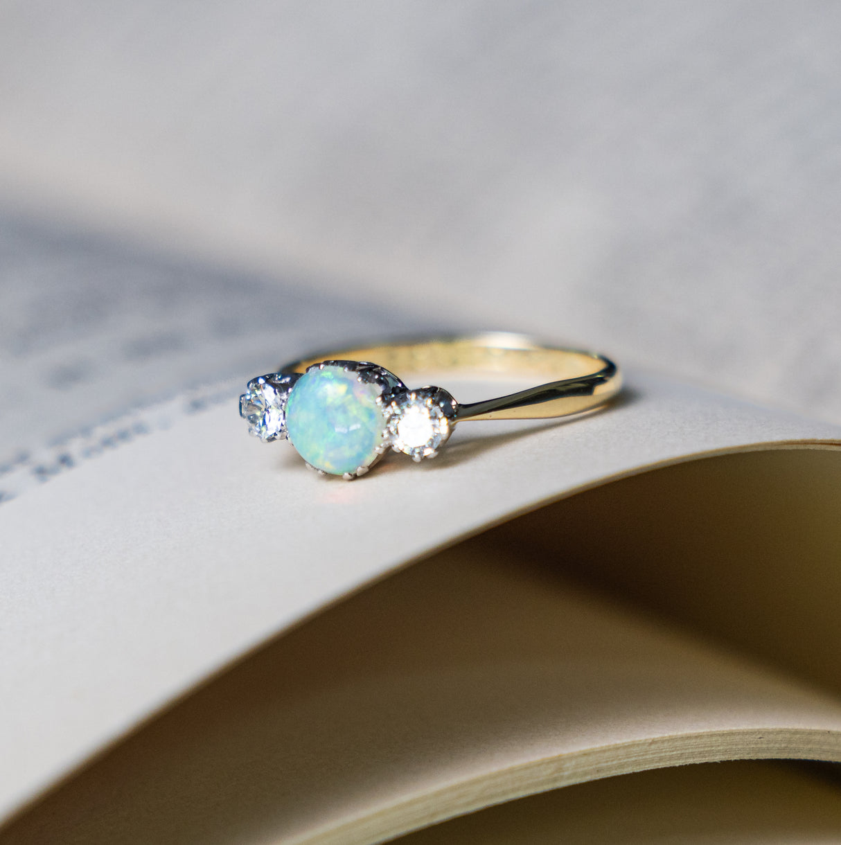 Antique, Edwardian opal and diamond three-stone ring side