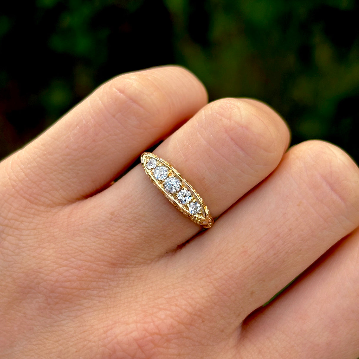 Antique, Edwardian five-stone diamond ring front worn on hand