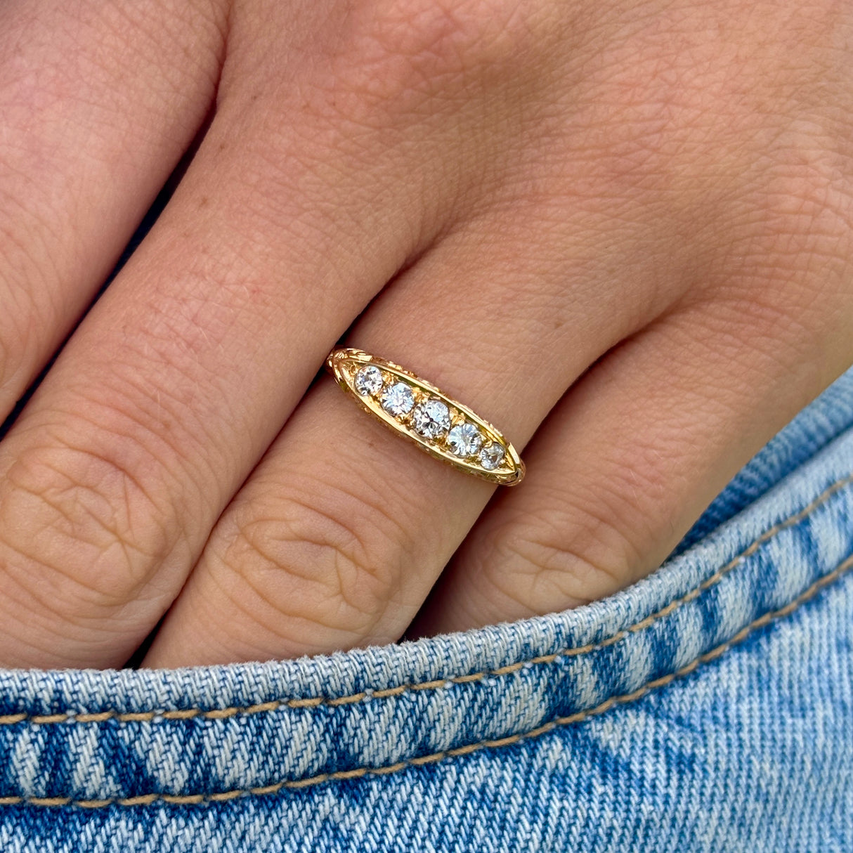 Antique, Edwardian five-stone diamond ring front worn on hand