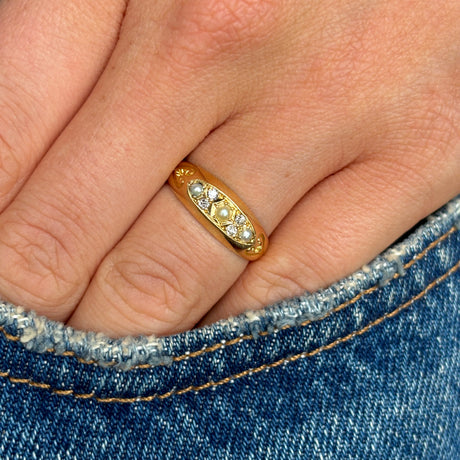 Antique, Edwardian pearl and diamond three-stone ring worn on hand