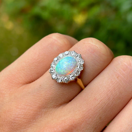 Antique, Edwardian opal & diamond cluster worn on hand.