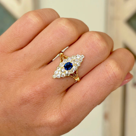 1877-Antique, Victorian sapphire & diamond navette cluster ring on hand.