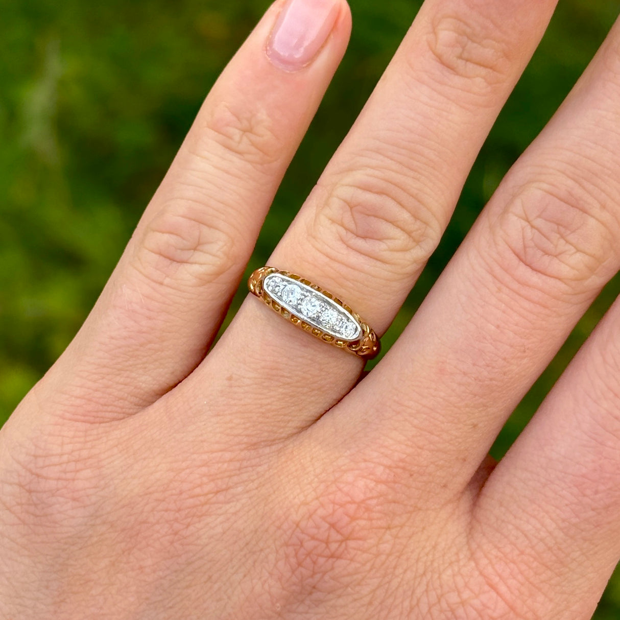 Antique, Edwardian five-stone diamond ring worn on hand