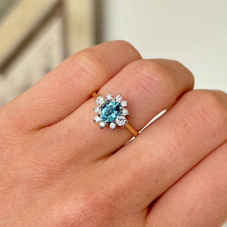 Vintage, 1950s aquamarine & diamond cluster ring worn on hand.