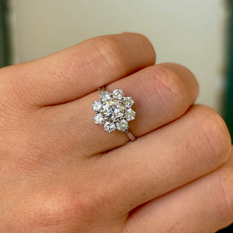 1955-Vintage, 1980s diamond cluster ring worn on hand