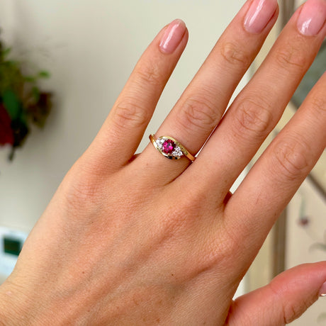 Antique, Edwardian ruby & diamond twist ring worn on hand.