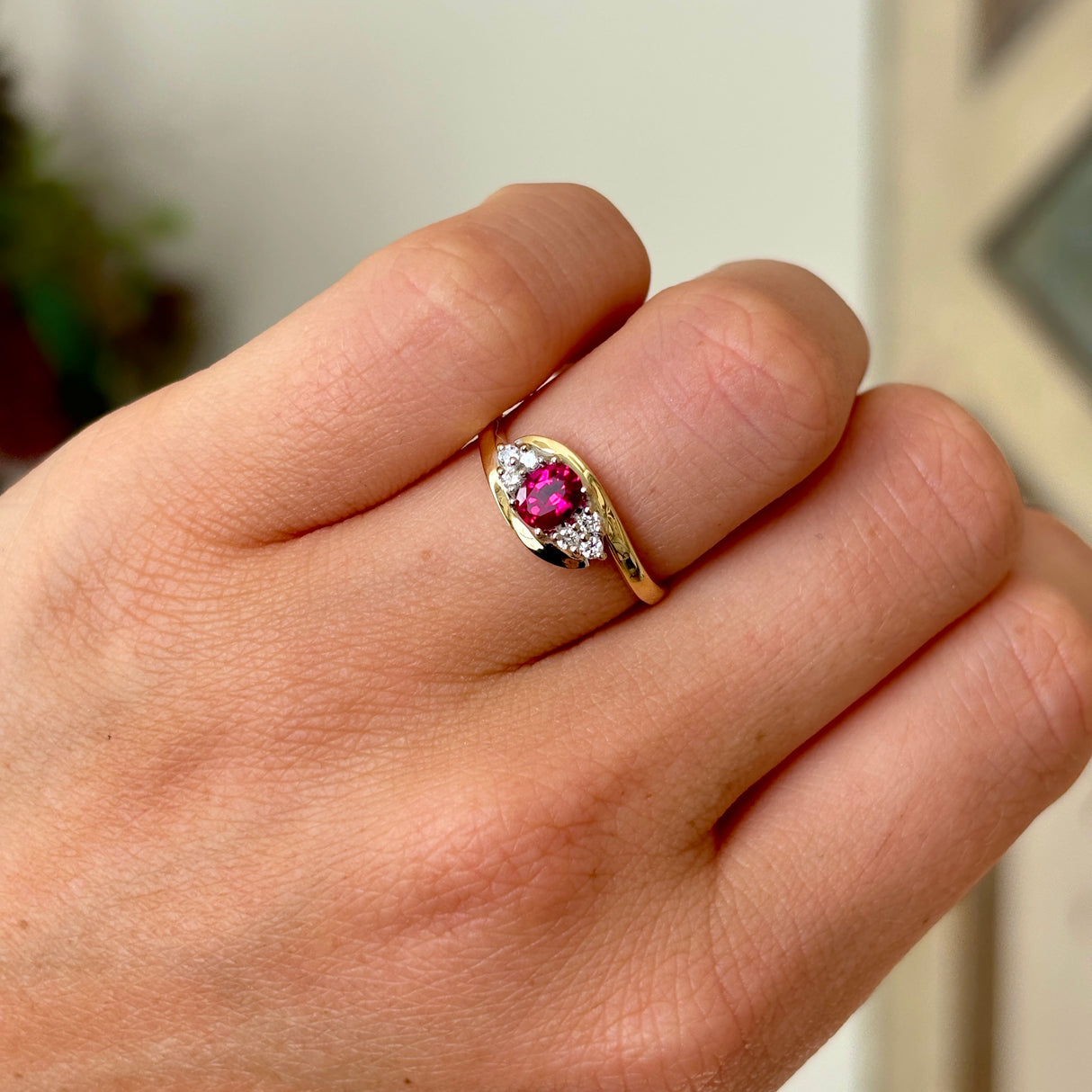 Antique, Edwardian ruby & diamond twist ring worn on hand.