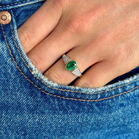 Vintage, 1970s inspired emerald & diamond ring worn on hand.