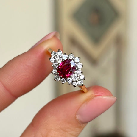 Vintage, 1970s ruby & diamond cluster ring in fingers.