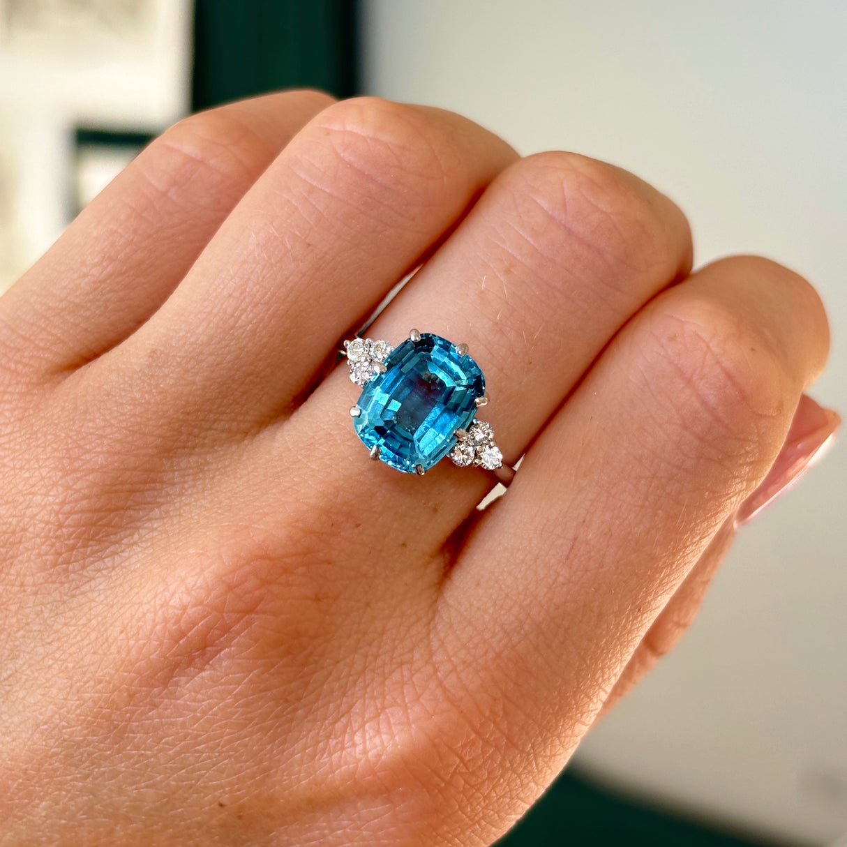 Vintage, 1970s blue topaz & diamond ring worn on hand.