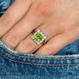 Antique, Edwardian peridot & diamond cluster ring worn on hand