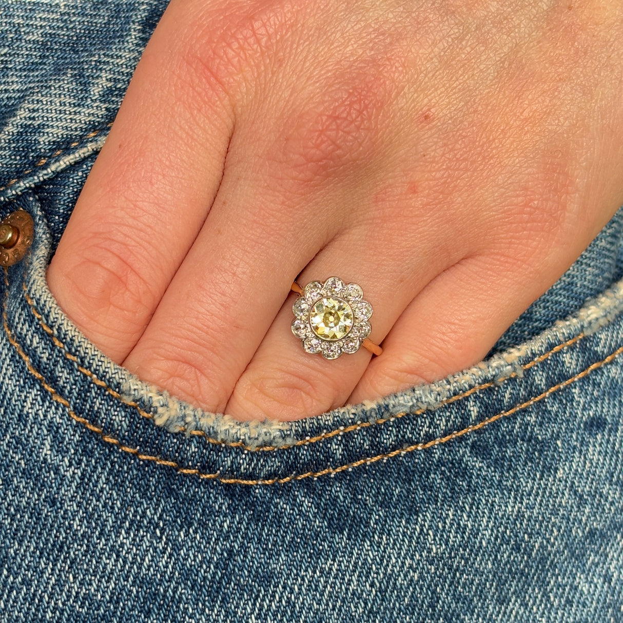 Antique, Edwardian tinted yellow diamond daisy cluster ring