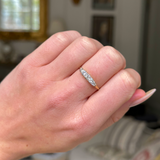 edwardian diamond half hoop ring on closed hand