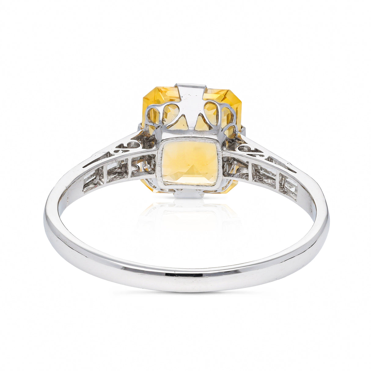 Edwardian, yellow-peach sapphire and baguette diamond engagement ring, platinum