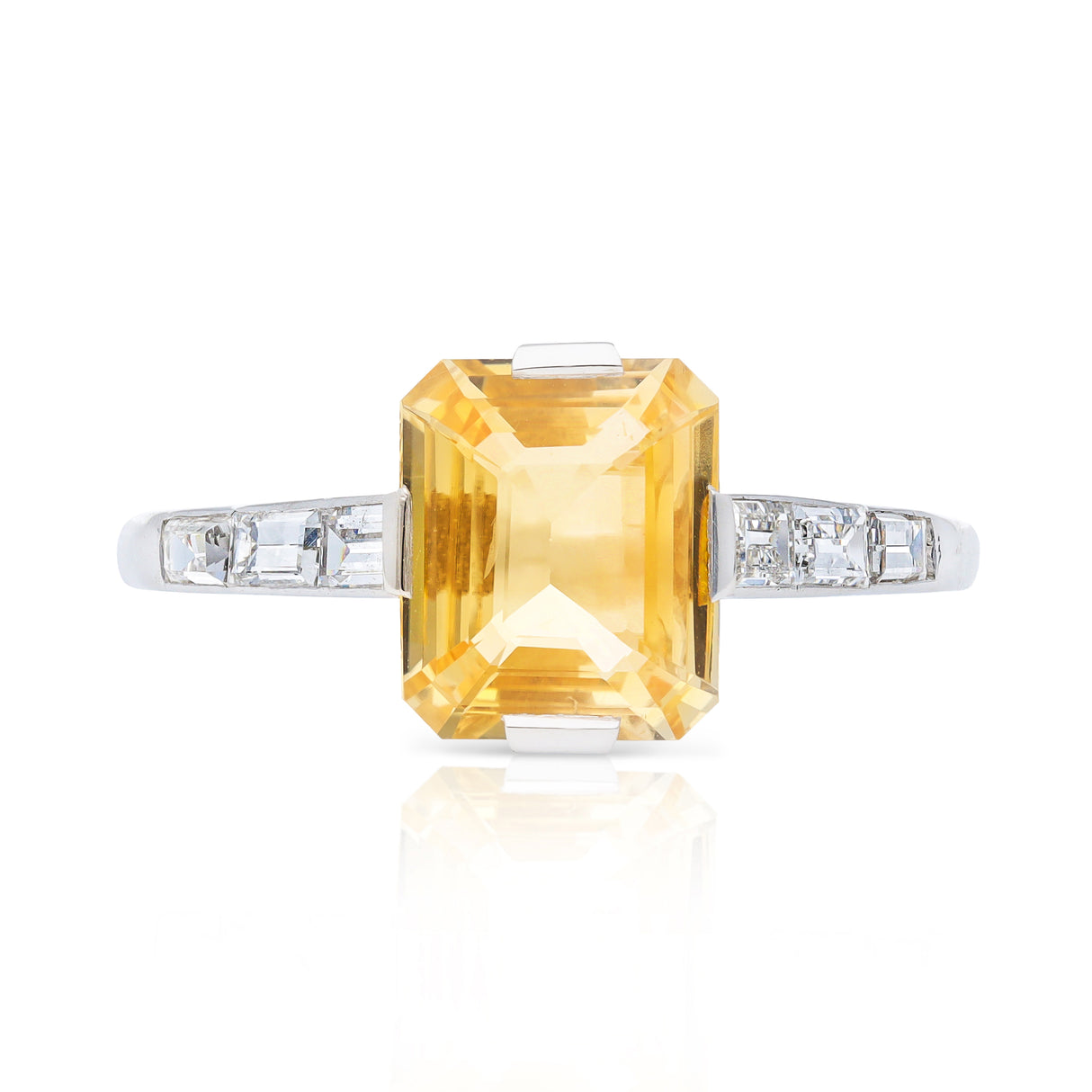 Edwardian, yellow-peach sapphire and baguette diamond engagement ring, platinum