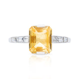 Edwardian, yellow-peach sapphire and baguette diamond engagement ring, platinum