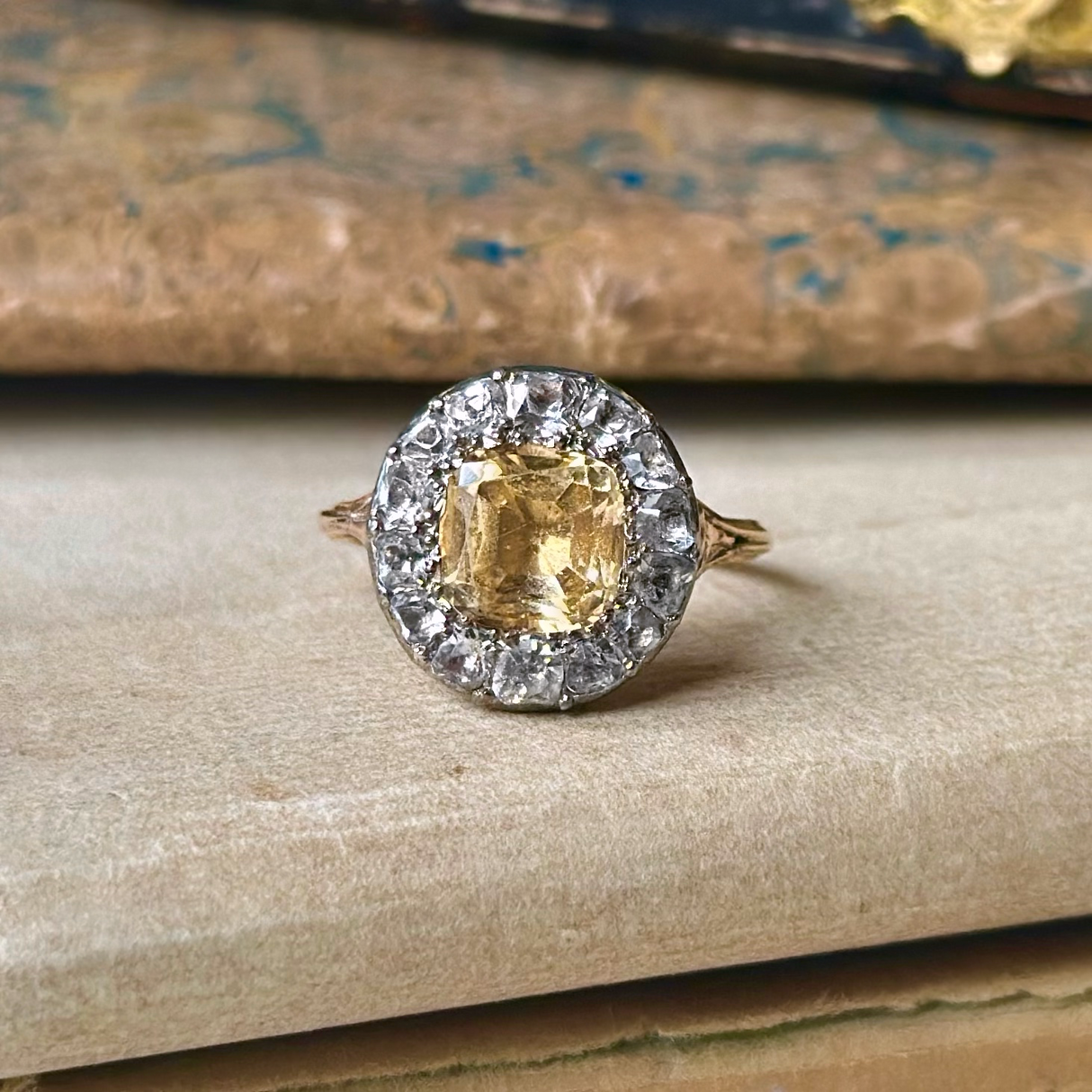 Antique yellow and white topaz cluster ring, front view.