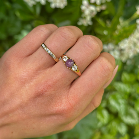 Antique, Edwardian Cabochon Star Ruby and White Sapphire Three-Stone Ring, 15ct Gold worn on hand.