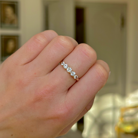 Antique, Edwardian Five Stone White Sapphire Ring, Yellow Gold worn on closed hand. 