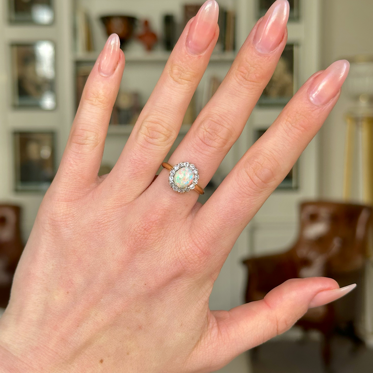 Antique, Edwardian White Opal and Diamond Cluster Ring worn on hand.