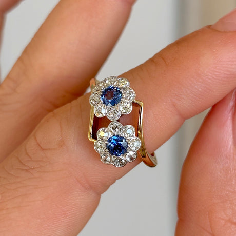 Antique, Edwardian sapphire & diamond double cluster ring worn on hand.