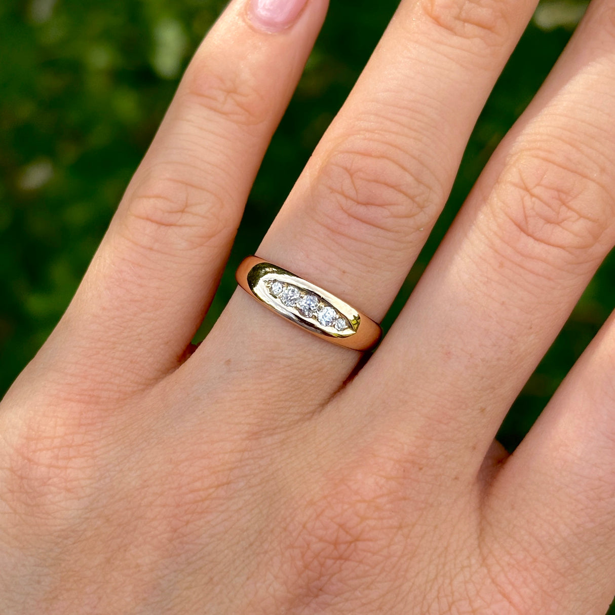 Antique, Edwardian five-stone diamond ring worn on hand