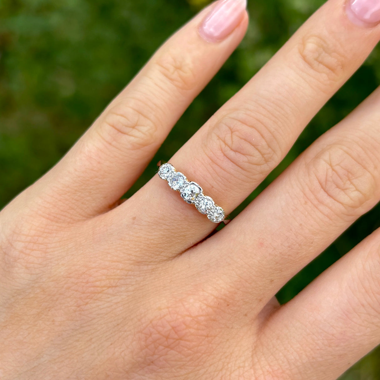 Antique, Edwardian half-hoop diamond ring, 18ct yellow gold and platinum worn on hand.