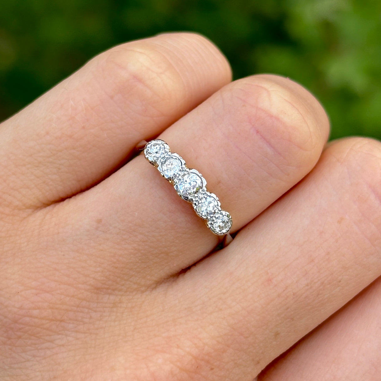 Antique, Edwardian half-hoop diamond ring, 18ct yellow gold and platinum worn on hand.