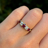 Antique, Victorian ruby & diamond five-stone ring worn on hand.