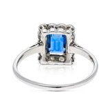 Antique, Art Deco, emerald-cut blue sapphire and diamond cluster ring, platinum