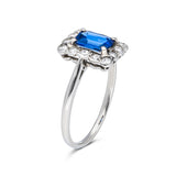 Antique, Art Deco, emerald-cut blue sapphire and diamond cluster ring, platinum