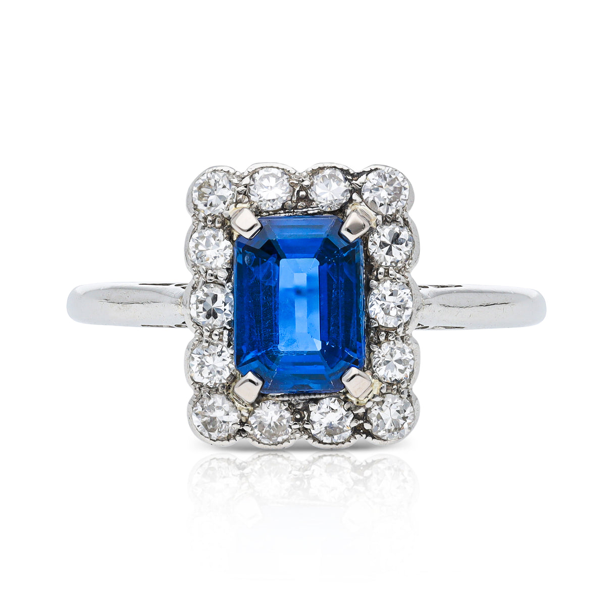 Antique, Art Deco, emerald-cut blue sapphire and diamond cluster ring, platinum