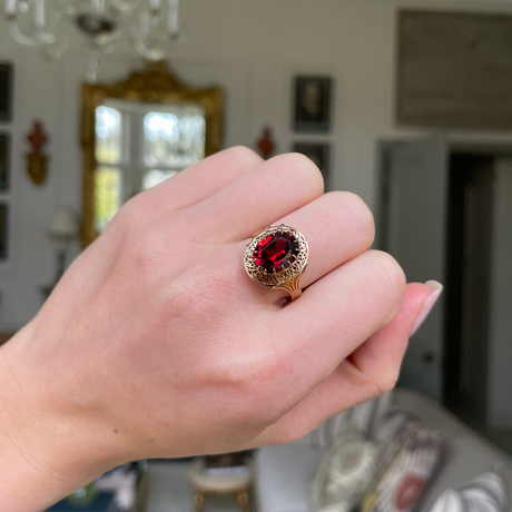 Belle Époque red garnet ring, worn on hand.