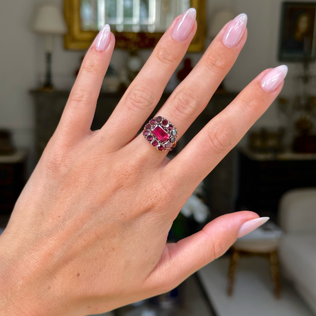 Georgian garnet cluster ring worn on hand.