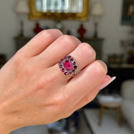 Georgian garnet cluster ring worn on closed hand.