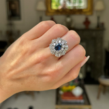 Vintage, 1950s oval blue sapphire and diamond ballerina cluster ring, 18ct white gold