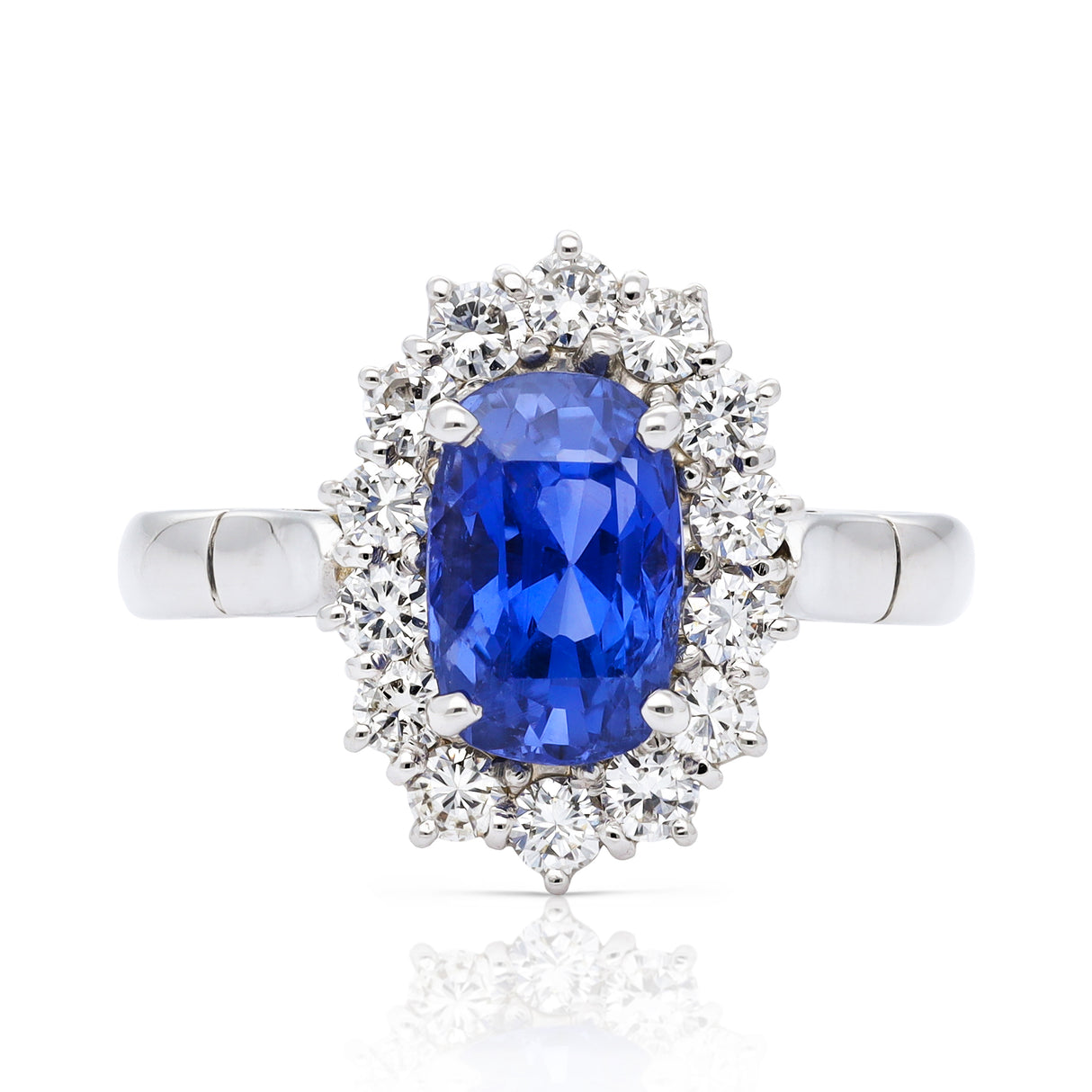 Sri lankan sapphire and diamond cluster engagement ring, 18ct white gold