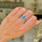 Antique, Art Deco, emerald-cut blue sapphire and diamond cluster ring, platinum